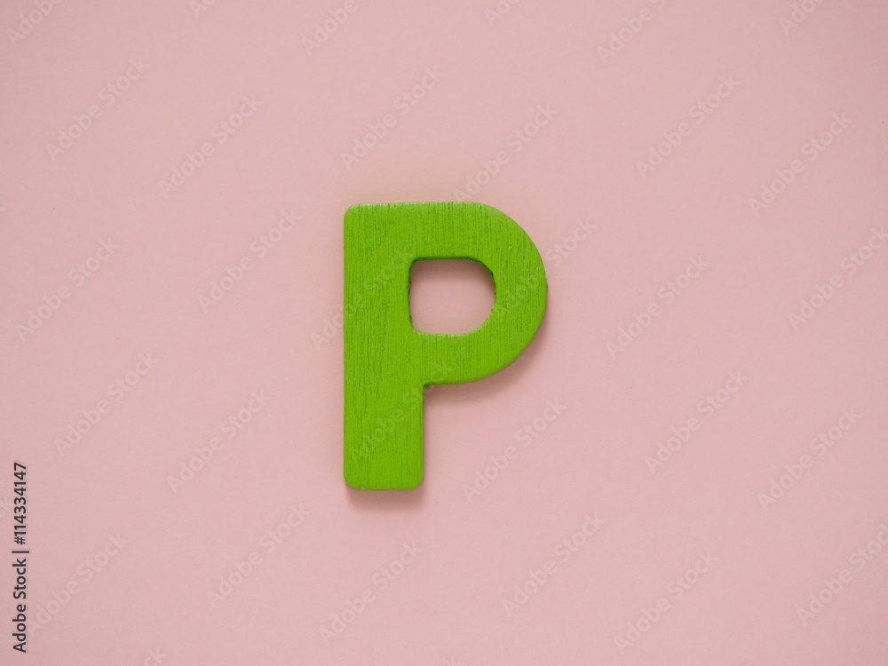 Capital letter P. Green letter P from wood on pink background. Capital letter P. Green letter P from wood on pink background.