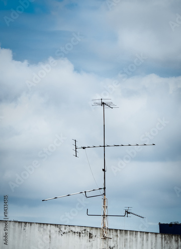 Old antenna for television with blue sky background, Silhouetted image