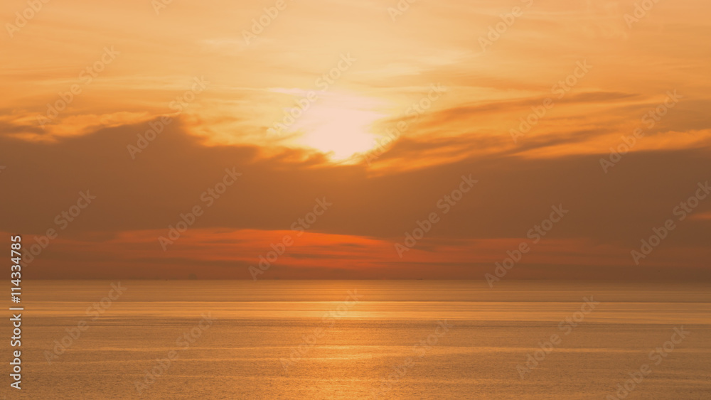 Perspectives of beautiful sunset above the sea. Orange sky at summer.