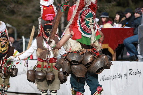 Pernik, Bulgaria - January 14, 2008: Unidentified man in traditional Kukeri costume are seen at the Festival of the Masquerade Games Surva in Pernik, Bulgaria.