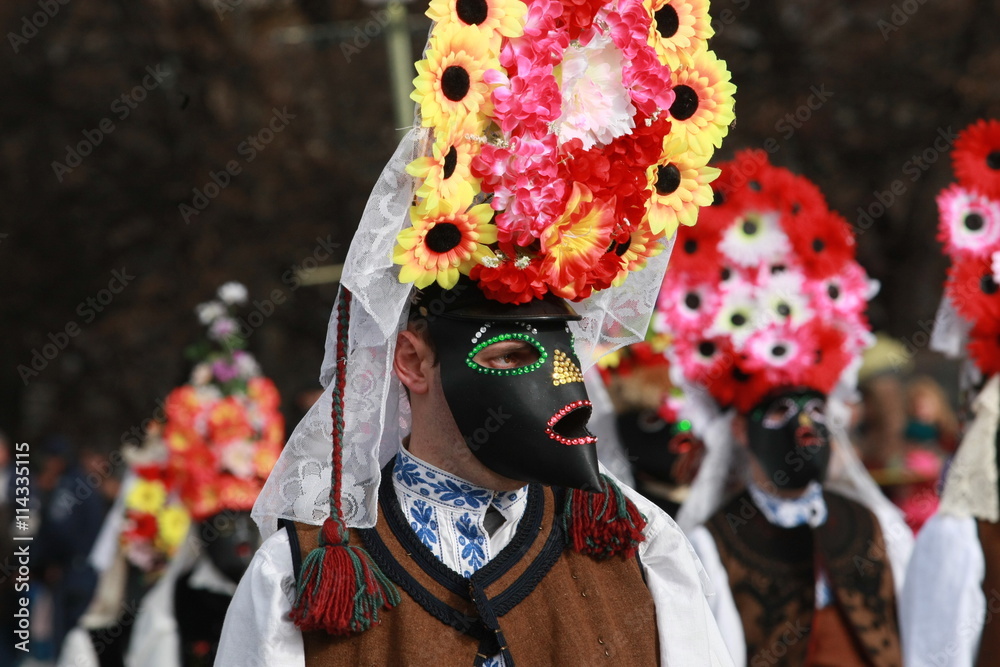 Pernik, Bulgaria - January 14, 2008: Unidentified man in traditional Kukeri costume are seen at the Festival of the Masquerade Games Surva in Pernik, Bulgaria.
