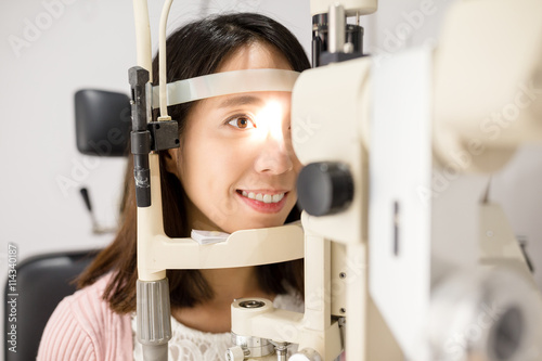 Woman undergo optical exam