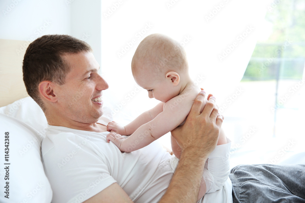 Father with adorable baby, close up Father with adorable baby, close up