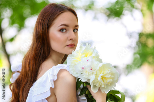 Beautiful girl with fresh spring bouquet