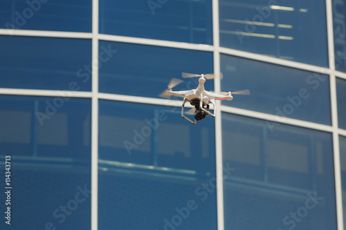 Drone flying with clear blue sky