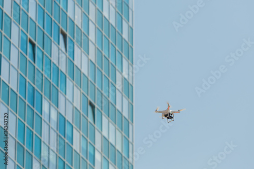 Drone flying with clear blue sky