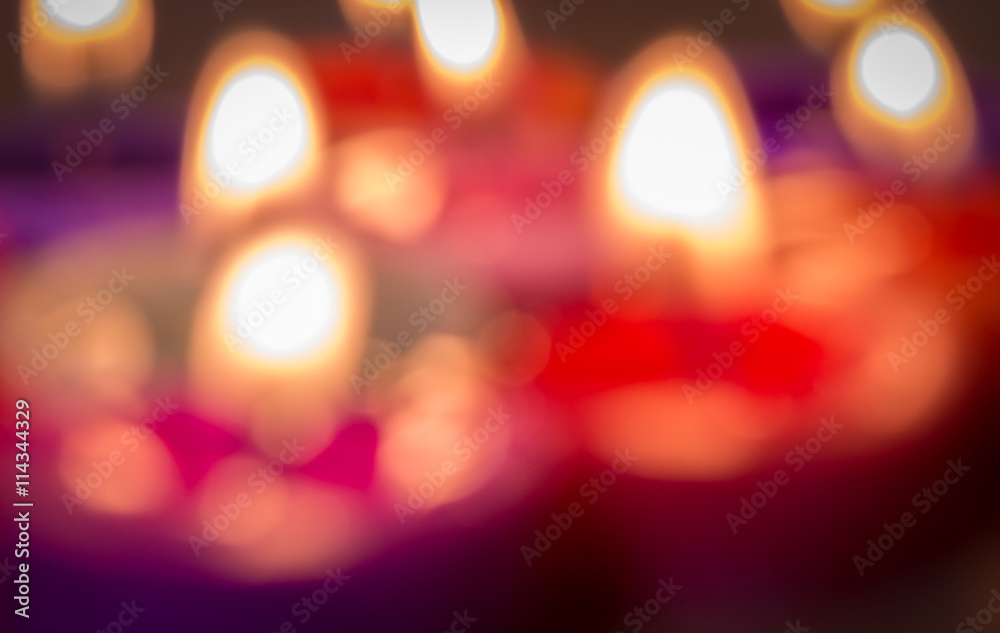 close up blurry multi color flame candle as a background close up blurry multi color flame candle as a background