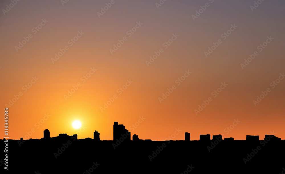 Silhouette, city in sunset with clear sky in tropical country