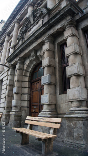 bench standing near Cape Town court with the words 