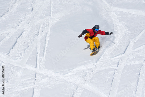 Snowboarder riding on loose snow Freeride