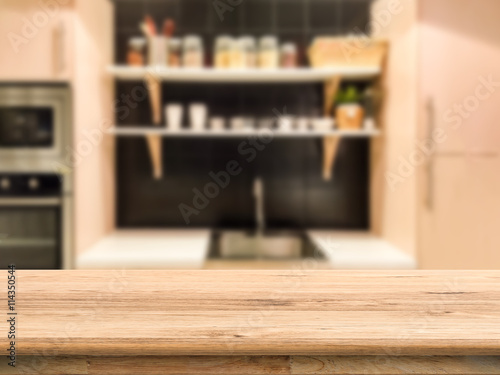 wooden counter top with kitchen cabinet background