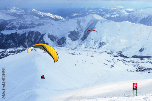 glider flying in mountainous terrain