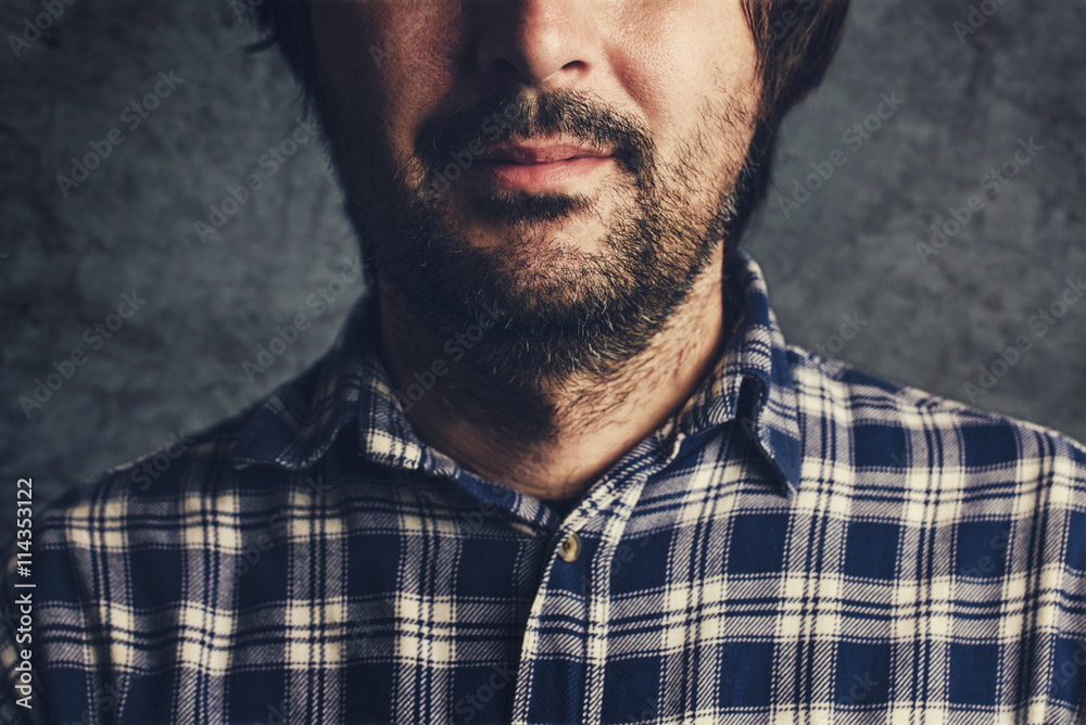 Casual man in plaid shirt thinking and contemplating Casual man in plaid shirt thinking and contemplating