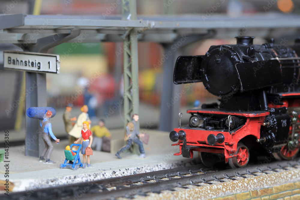Naklejka premium miniature model steam locomotive at station platform