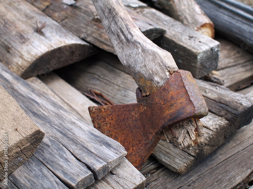 Wallpaper Mural Used rusty axe with rotten haft on old wooden boards, closeup, shallow depth of field Torontodigital.ca