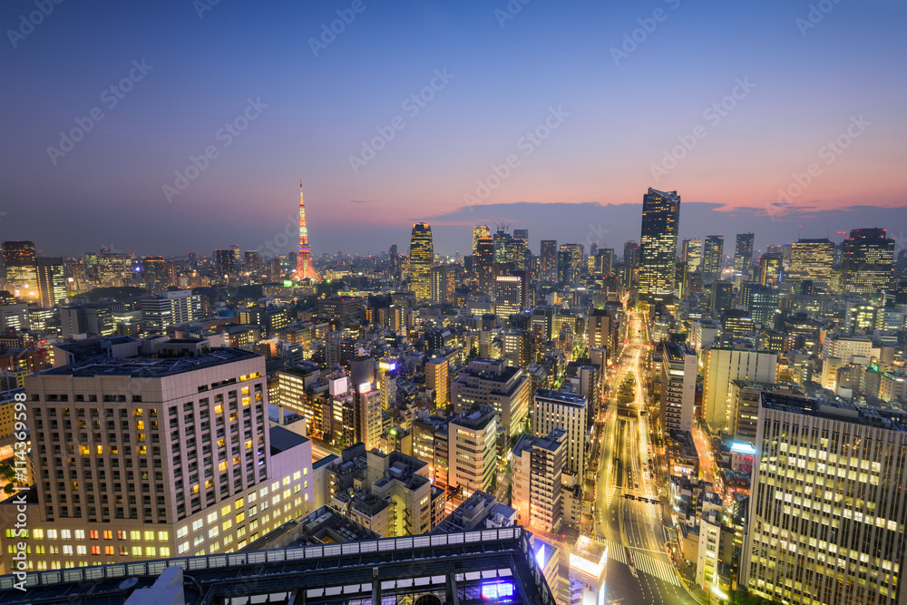 Tokyo, Japan skyline over Shiodome district towards Tokyo Tower.