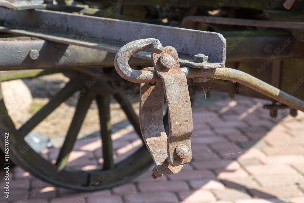 Old rusty forged metal elements. Parts of vintage horse wagon