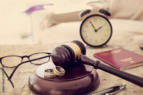 Law concept, gavel, clock and money on wooden table