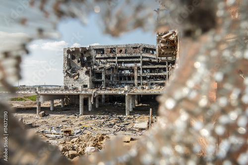 Wide Angle view of donetsk airport ruins through broken glass after massive artillery shelling