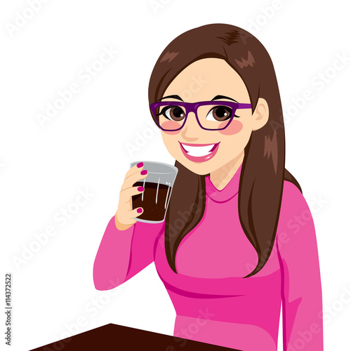 Beautiful brunette young woman with glasses smiling holding drink glass sitting on table