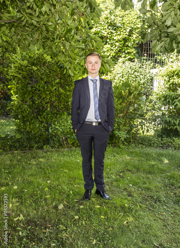 portrait of young teenager in suit