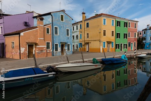 Venetian island of Burano is known for its brightly colored homes. The colors of the houses follow a specific system originating in the middle ages.