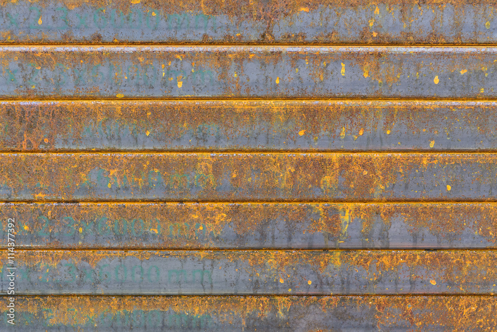 The rectangle tube, the rectangle steel tube stack with the rusty in the construction site. The corrosion on the steel tube pile cause of the rust.The rusty texture on the steel pile.