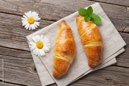 Croissants and chamomile flowers