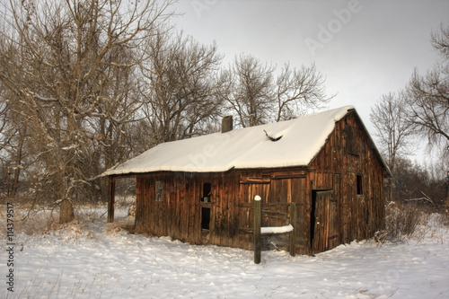 old farm building in winter scenery