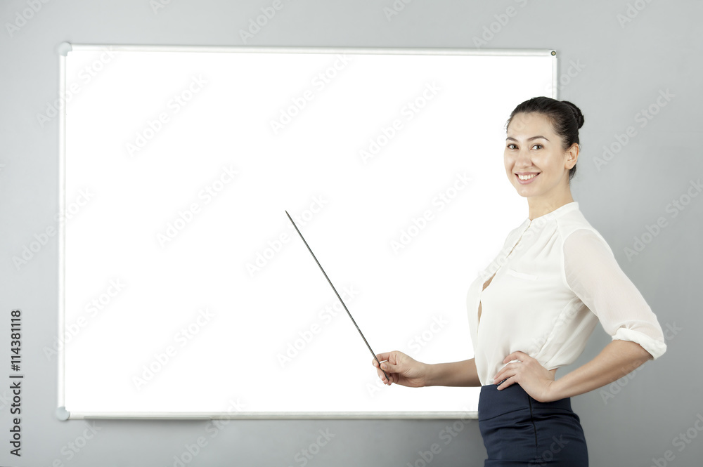 beautiful businesswoman smiling and pointing to the eastern ussiaexterior of an office white board Pointer beautiful businesswoman smiling and pointing to the eastern ussiaexterior of an office white board Pointer
