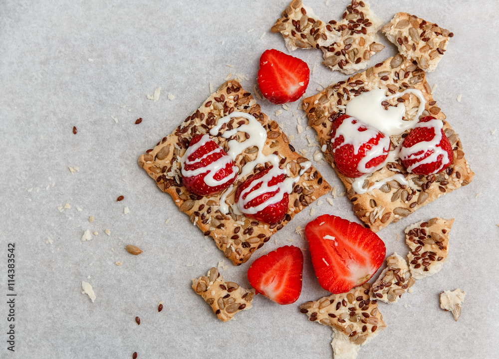 Red Fresh Strawberries are on the Cracker with Grains.Evaporated Milk on the White Paper.Breakfast Organic Healthy Tasty Food.Cooking Vitamins Ingredients.Summer Fruits.Top View Red Fresh Strawberries are on the Cracker with Grains.Evaporated Milk on the White Paper.Breakfast Organic Healthy Tasty Food.Cooking Vitamins Ingredients.Summer Fruits.Top View