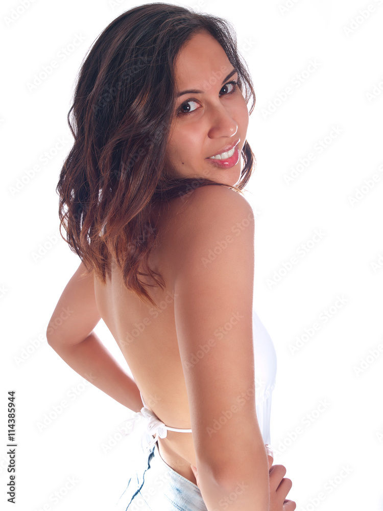 Fototapeta premium young woman in white bathing suit and denim shorts