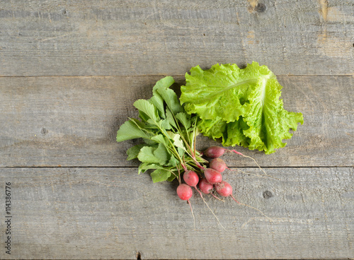 Organic food. ingredients for saladon old, rustic, wooden table. photo