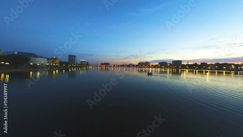 Wallpaper Mural Nightfall. Beautiful sunset over water and city lights switching on Torontodigital.ca