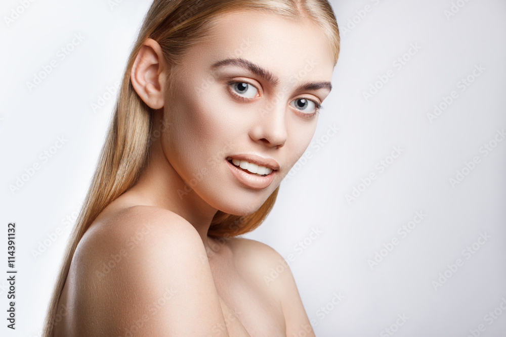 Portrait of a young beautiful blue-eyed girl. Beautiful make-up, perfectly smooth hair, blue eyes, open arms, perfect skin. Portrait of a young beautiful blue-eyed girl. Beautiful make-up, perfectly smooth hair, blue eyes, open arms, perfect skin.