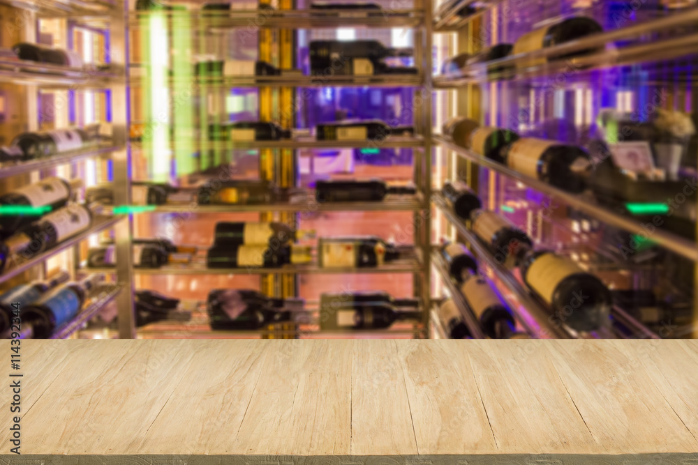Wood floor with blur of alcohol bar background
