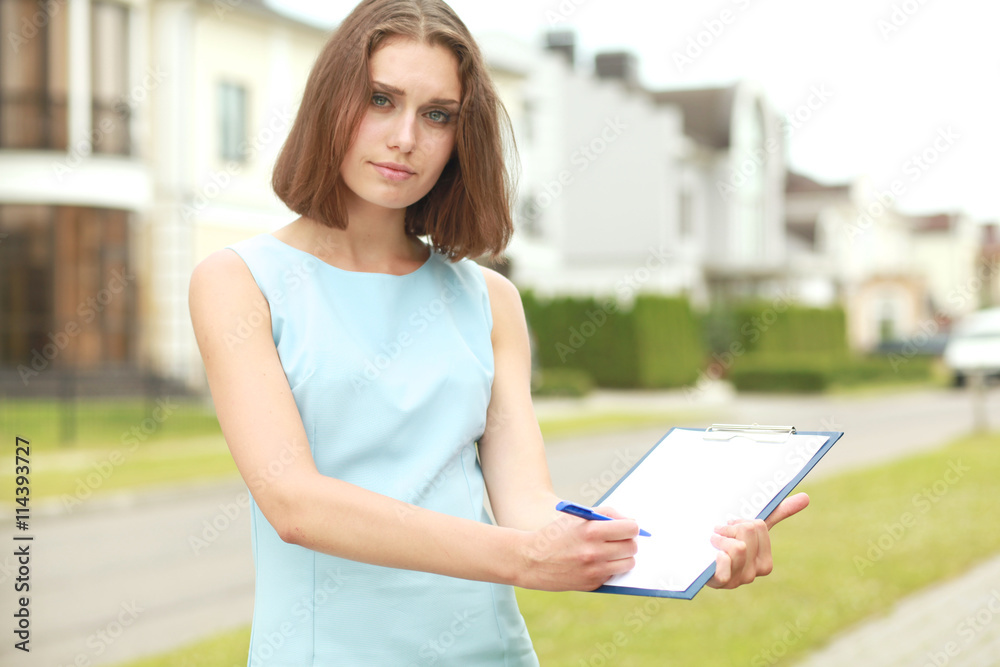 woman with a folder of papers