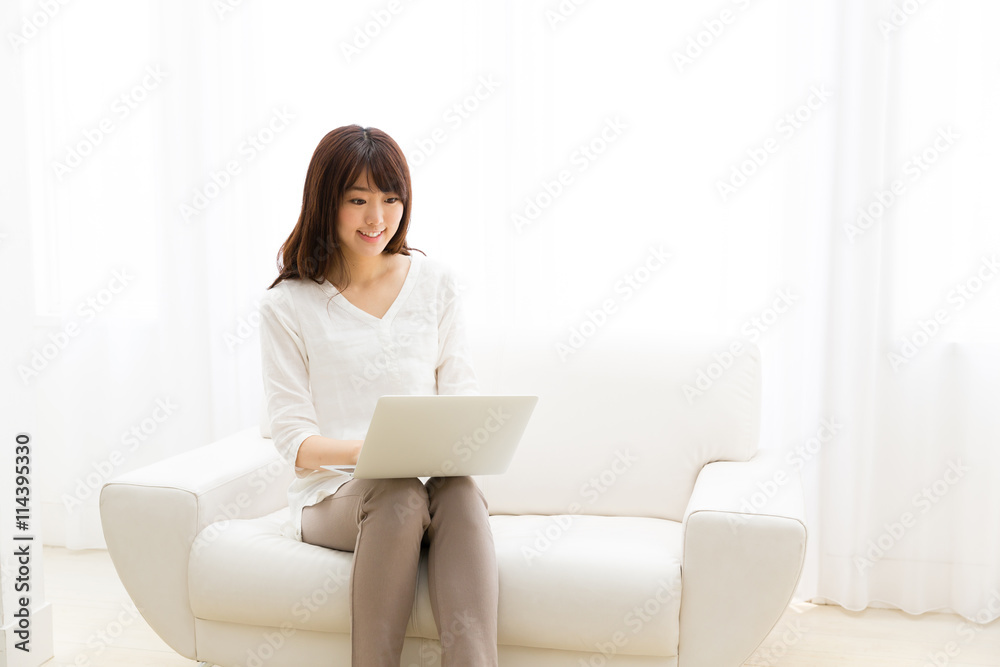 attractive asian woman using laptop