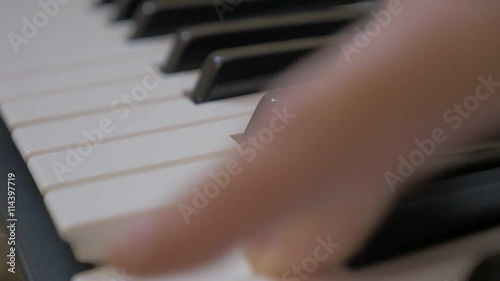 Improvised one finger glissando on electric keyboard slow motion 1920X1080 HD footage - Slow-mo glissando roll over piano keys 1080p FullHD video  photo