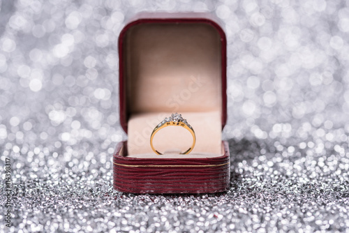 gold ring with diamond. Jewelry with bokeh background