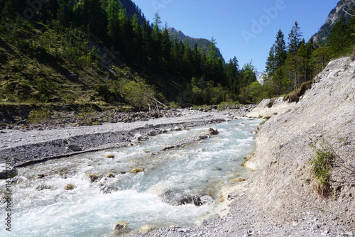 Beautiful clear river at the valley of Wimbachgries with blue sk