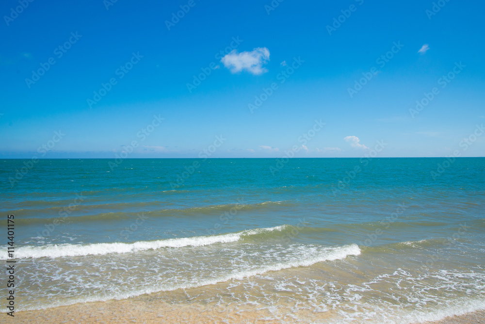 Turquoise sea wave on the empty sea beach blue sky sand sun daylight.