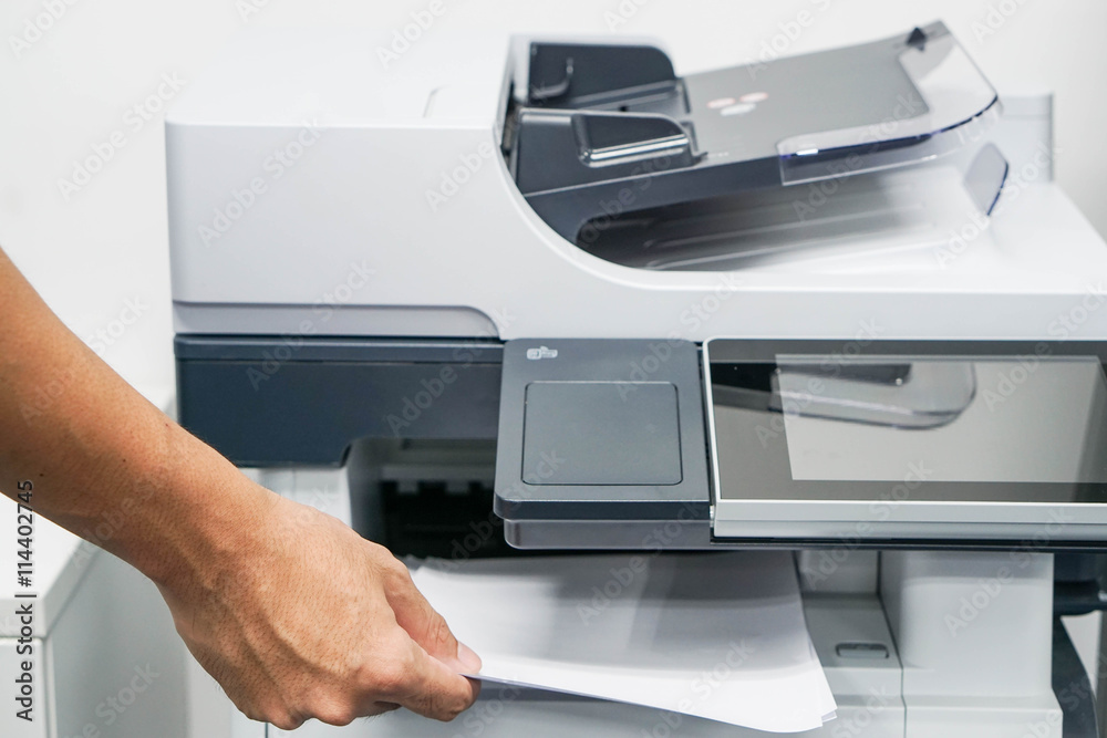 Close up printing and copying a document in the office Close up printing and copying a document in the office