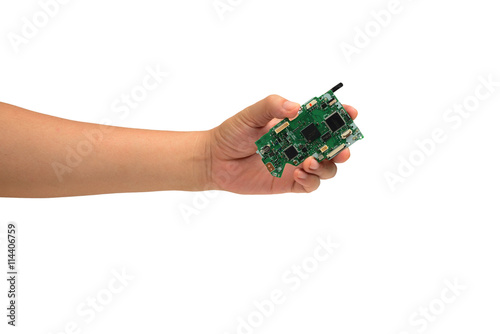 Hand holding IC chip isolated on white
