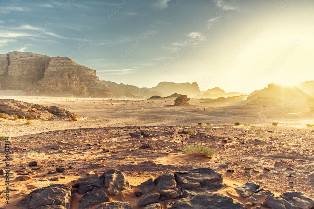 Fototapeta premium Desert Landscape of Wadi Rum in Jordan, with a sunset, stones, b