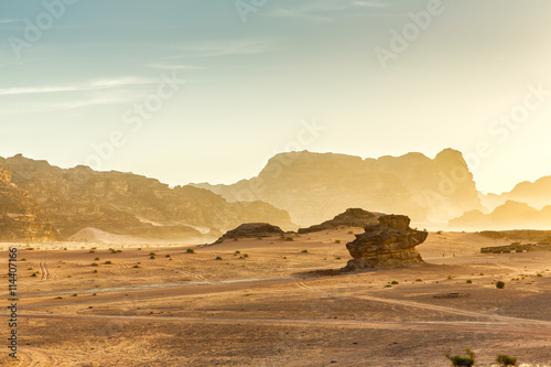 Desert Landscape of Wadi Rum in Jordan, with a sunset, stones, b