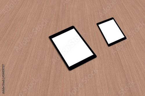 Two tablet pc devices on wooden desk with isolated white screen