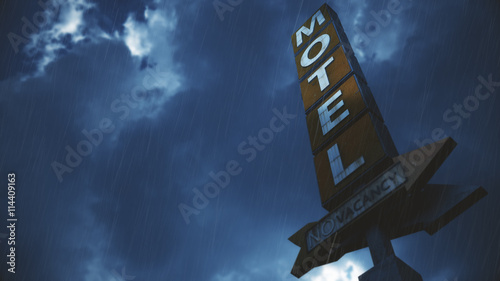 Old Grungy Motel Sign in Rain.Real Clouds Timelapse and 3D Design Composite photo