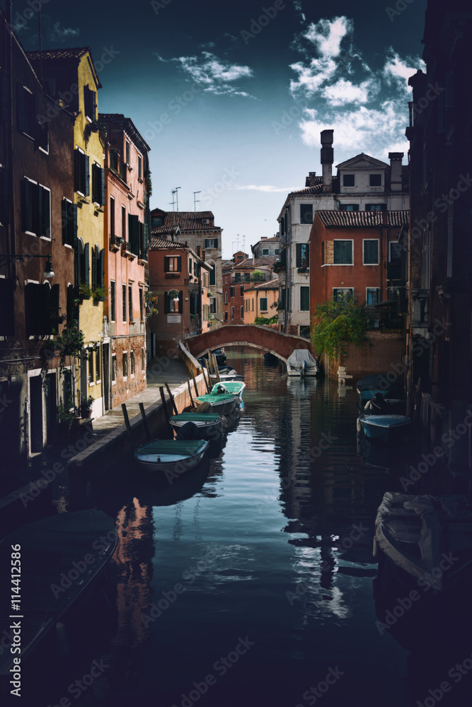 Fototapeta premium Street scene with canal in Venice, Italy
