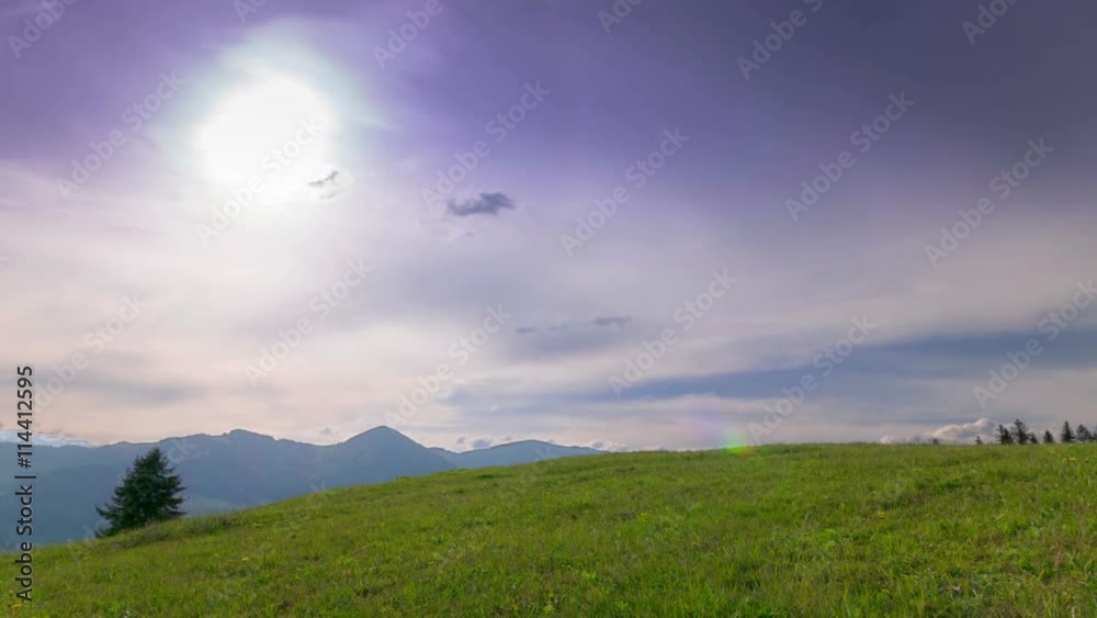4K . Green mountains, hills and sun clouds in evening time. Time lapse without birds. 4K . Green mountains, hills and sun clouds in evening time. Time lapse without birds.